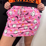 Pink checkered Halloween skort with ghosts, bats, candy corn and built-in shorts.