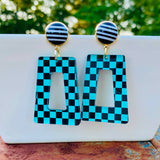 Teal and black checkered acrylic dangle earrings with black polka dot stud.
