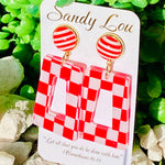 Red and white checkered acrylic earrings with striped stud tops.