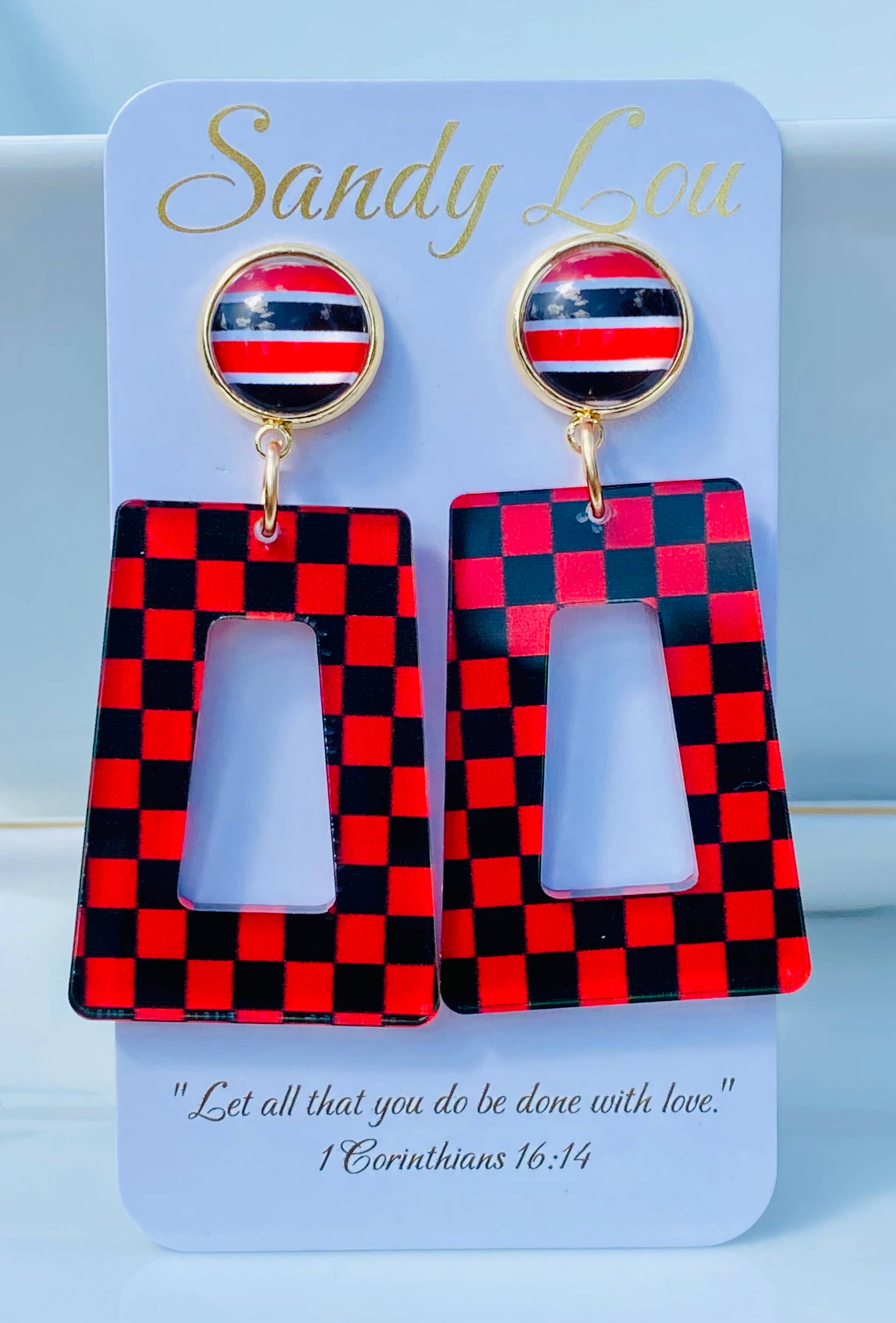 Red and black checkered acrylic dangle earrings with coordinating striped studs.