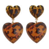 Double heart cheetah print acrylic drop earrings with lightweight layered heart design.