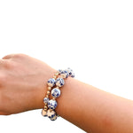 Two-piece Chinoiserie bracelet stack with gold accents and mixed bead sizes.