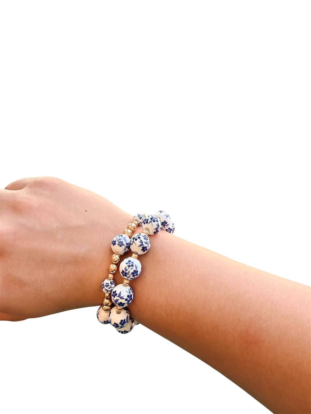 Two-piece Chinoiserie bracelet stack with gold accents and mixed bead sizes.