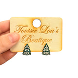 Green enamel Christmas tree stud earrings with gold outline and white garland design.