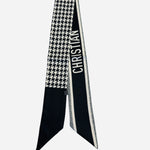 Black and white twilly scarf with houndstooth and typography details.
