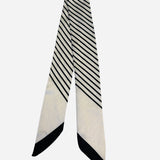 Black and ivory twilly scarf with sleek diagonal stripe design.