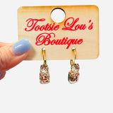 Clear gemstone drop earrings with matching top and bottom stones and gold hardware.