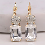 Clear rectangle rhinestone earrings with round rhinestone top and fish hook dangle.