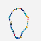 Multicolor candy bead charm necklace with gold accents and front clasp for interchangeable charms. 