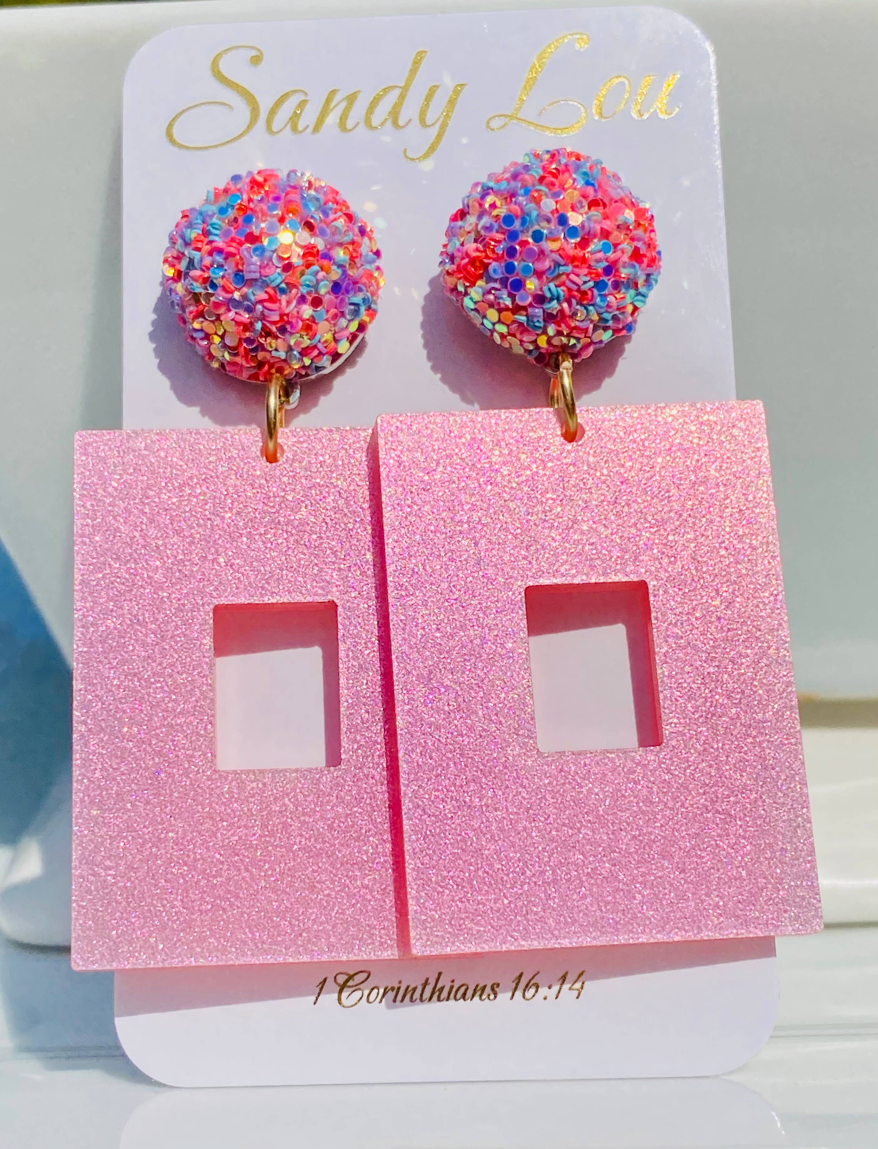 Pink glitter square earrings with sparkling multicolor confetti-style round studs.
