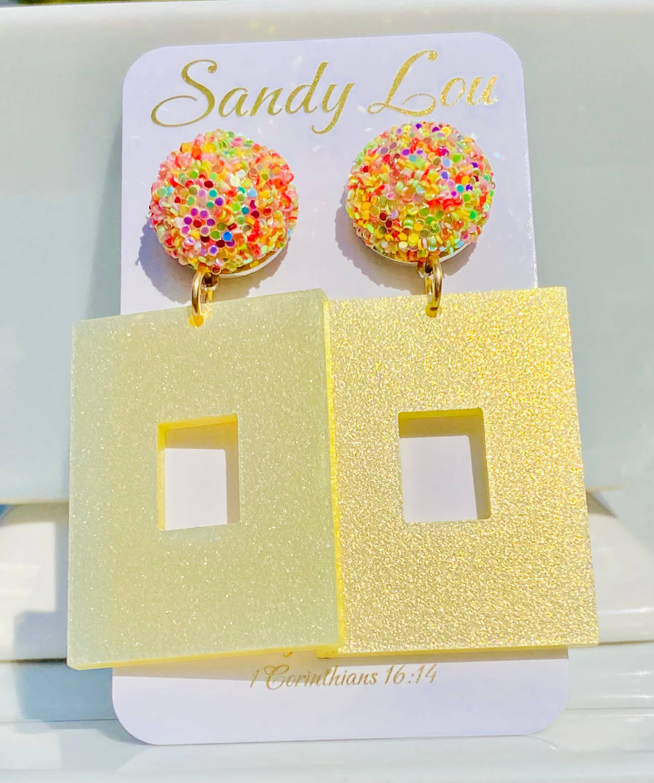 Yellow glitter square earrings with sparkling multicolor confetti-style round studs.