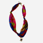 Colorful abstract polka dot scarf necklace with blue heart charm and gold chain extender.