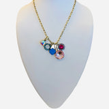 Gold necklace with colorful asymmetrical crystal charm cluster