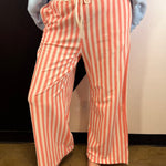 Coral and white striped wide leg pants with elastic drawstring waist and pockets