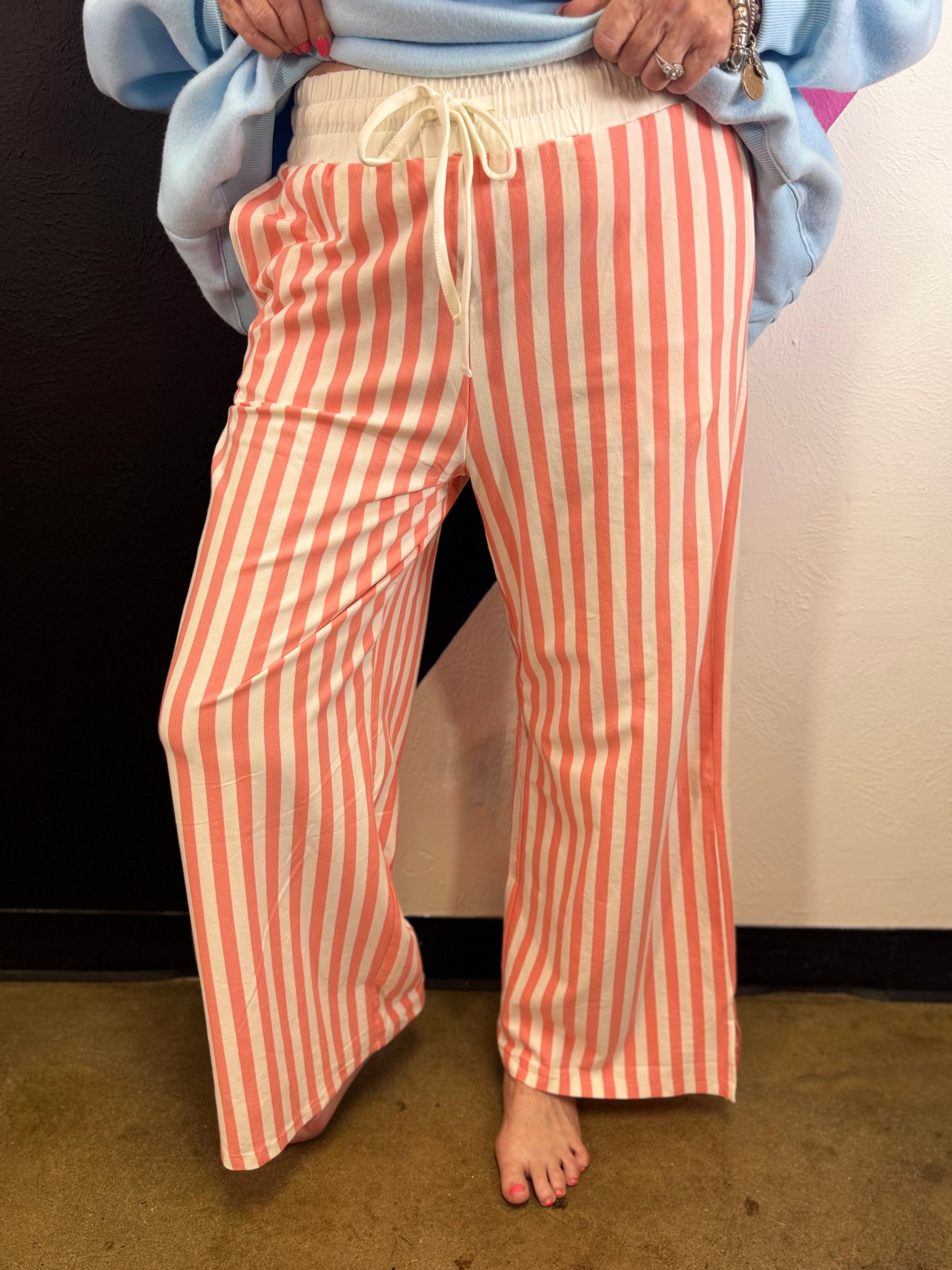 Coral and white striped wide leg pants with elastic drawstring waist and pockets