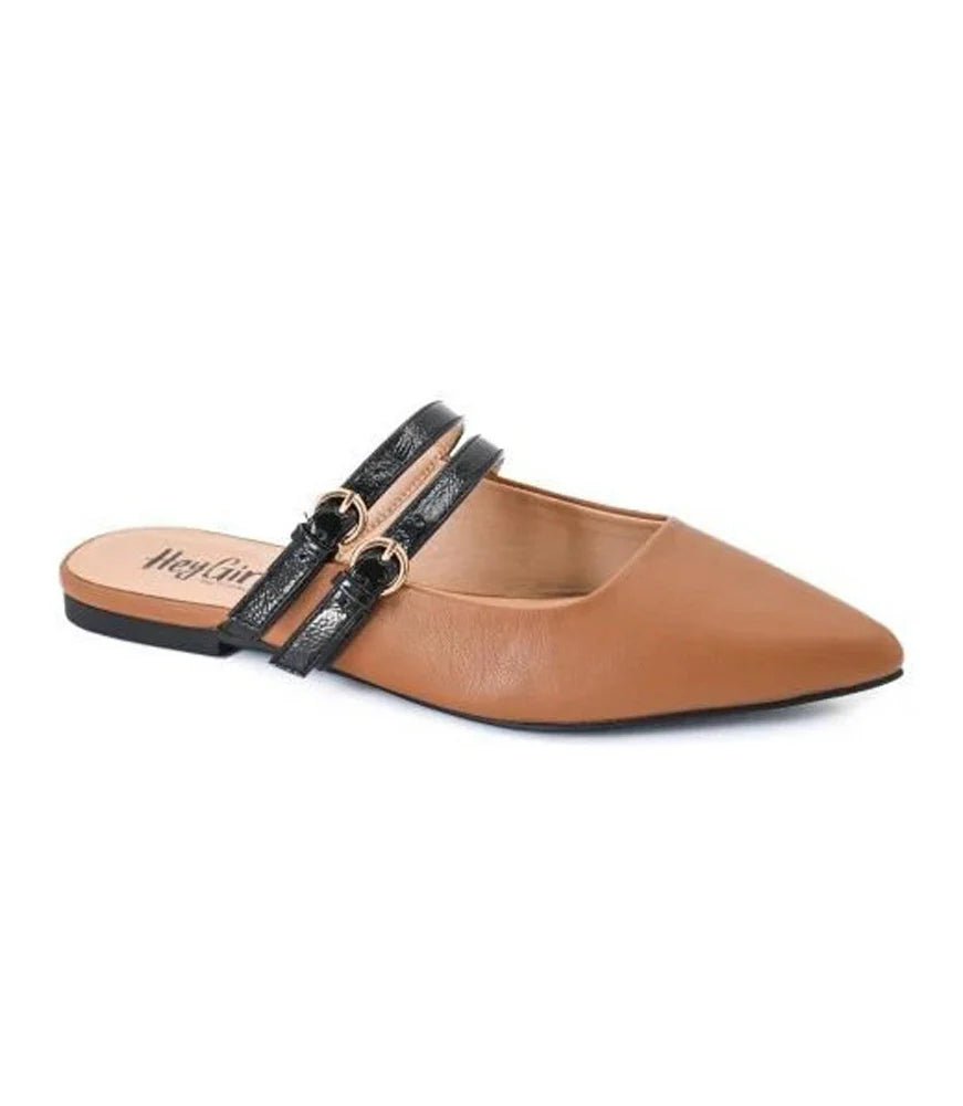 Cognac pointed-toe mule flats with black patent straps and gold buckles.