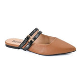 Cognac pointed-toe mule flats with black patent straps and gold buckles.