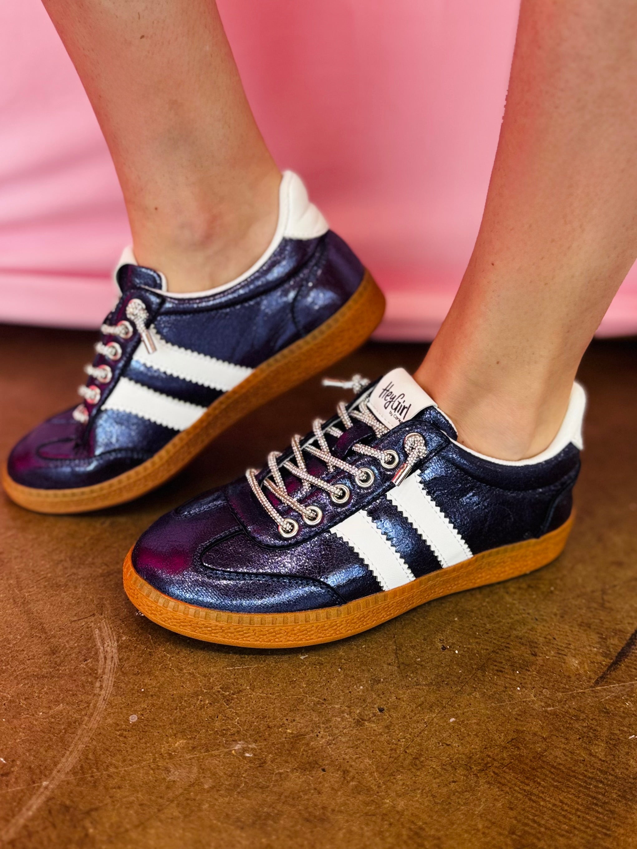 Navy metallic Corky's sneakers with white side stripes and lace-up closure.