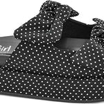 Black polka dot platform sandals with oversized bow accents and slip-on design.