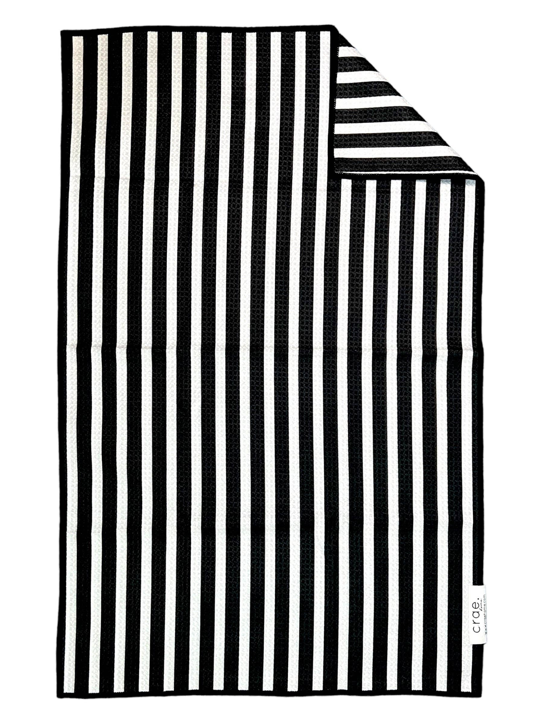Black and white striped double-sided microfiber hand towel with waffle weave texture.