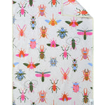 White microfiber hand towel with colorful bug print and waffle weave texture