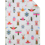 White microfiber hand towel with colorful bug print and waffle weave texture