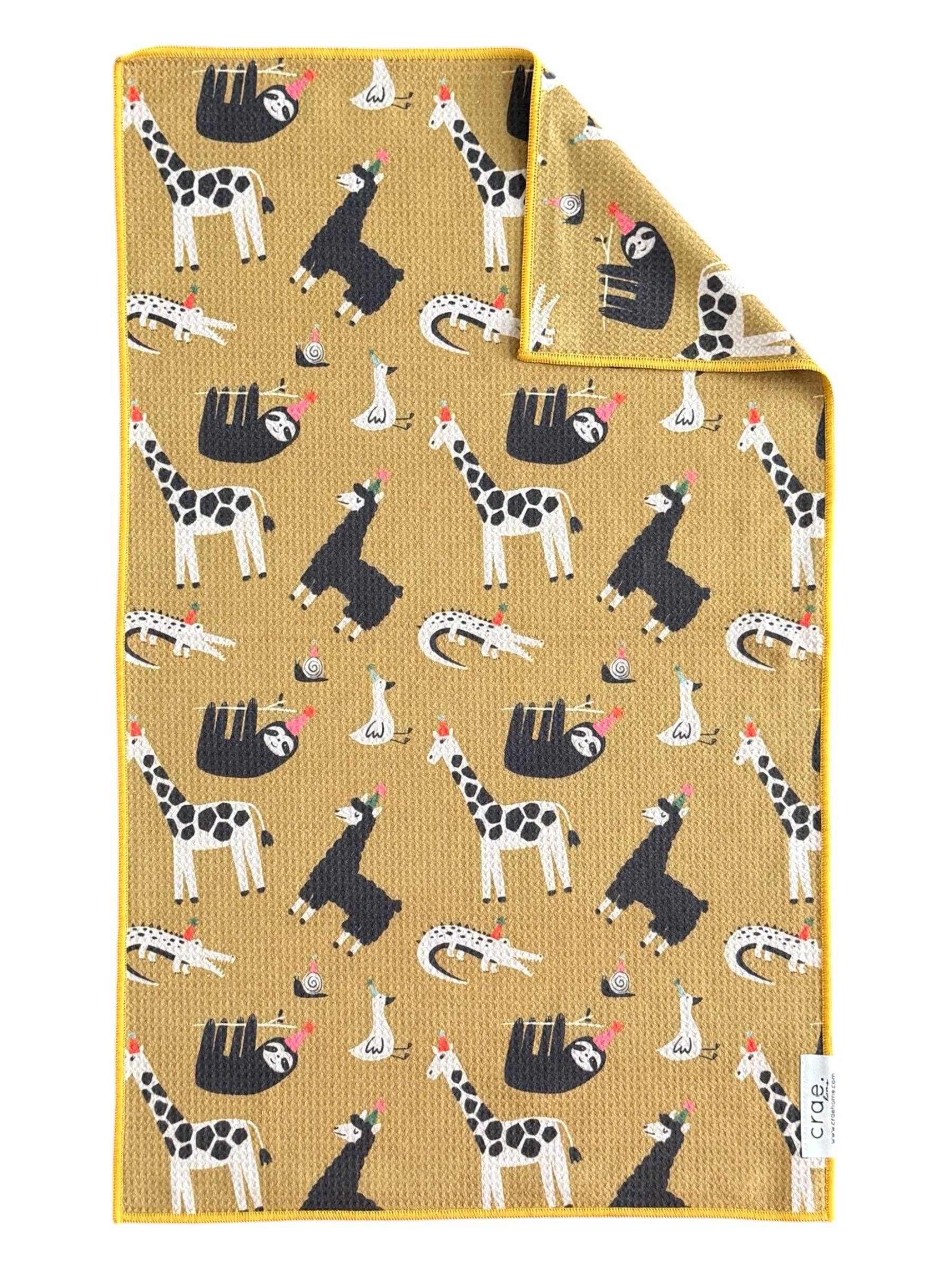 Colorful animal party hand towel with giraffes, sloths, llamas, ducks, and yellow trim.