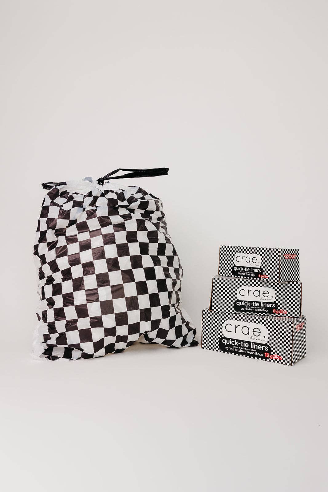 Black and white checkered 8-gallon trash liners for home and office waste baskets.