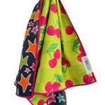 Crae Cherry Burst reversible hand towel, 19x29 in, cherry print front and colorful star design back.