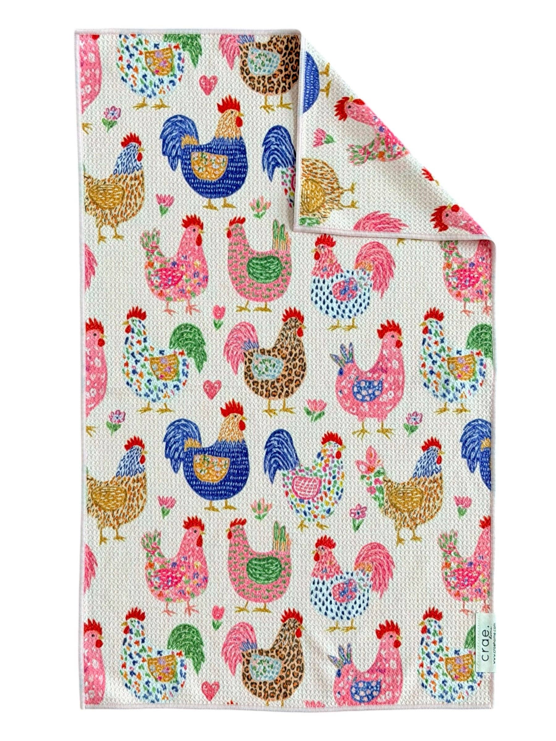 Crae hand towel with colorful patterned chickens, roosters, florals, leopard print, hearts, and polka dots.