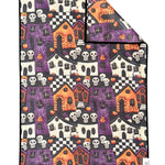 Crae Frightville microfiber hand towel, 17x27 in, Halloween print with haunted houses, pumpkins, skulls, and checkerboard.