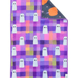Reversible Halloween towel with white ghosts, colorful plaid and pumpkin print.