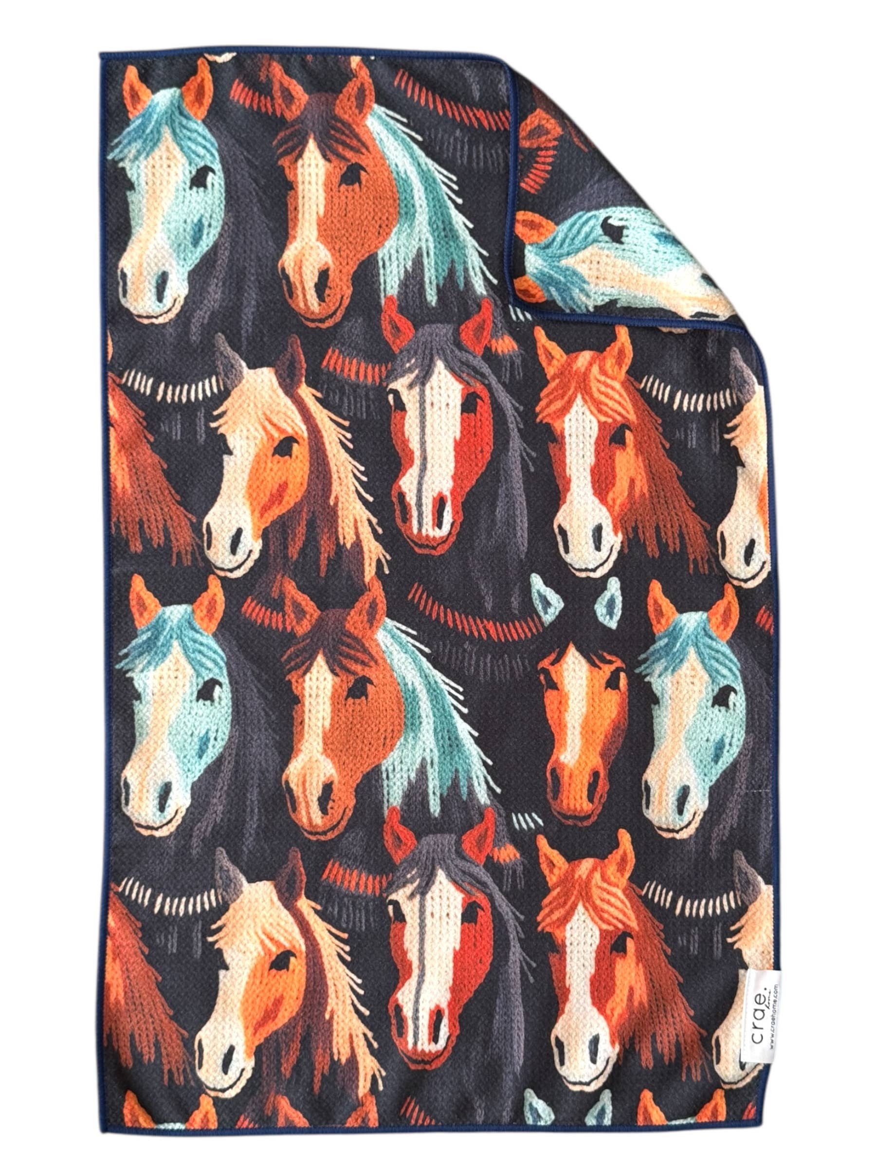 Dark microfiber hand towel featuring horse print design and waffle weave texture