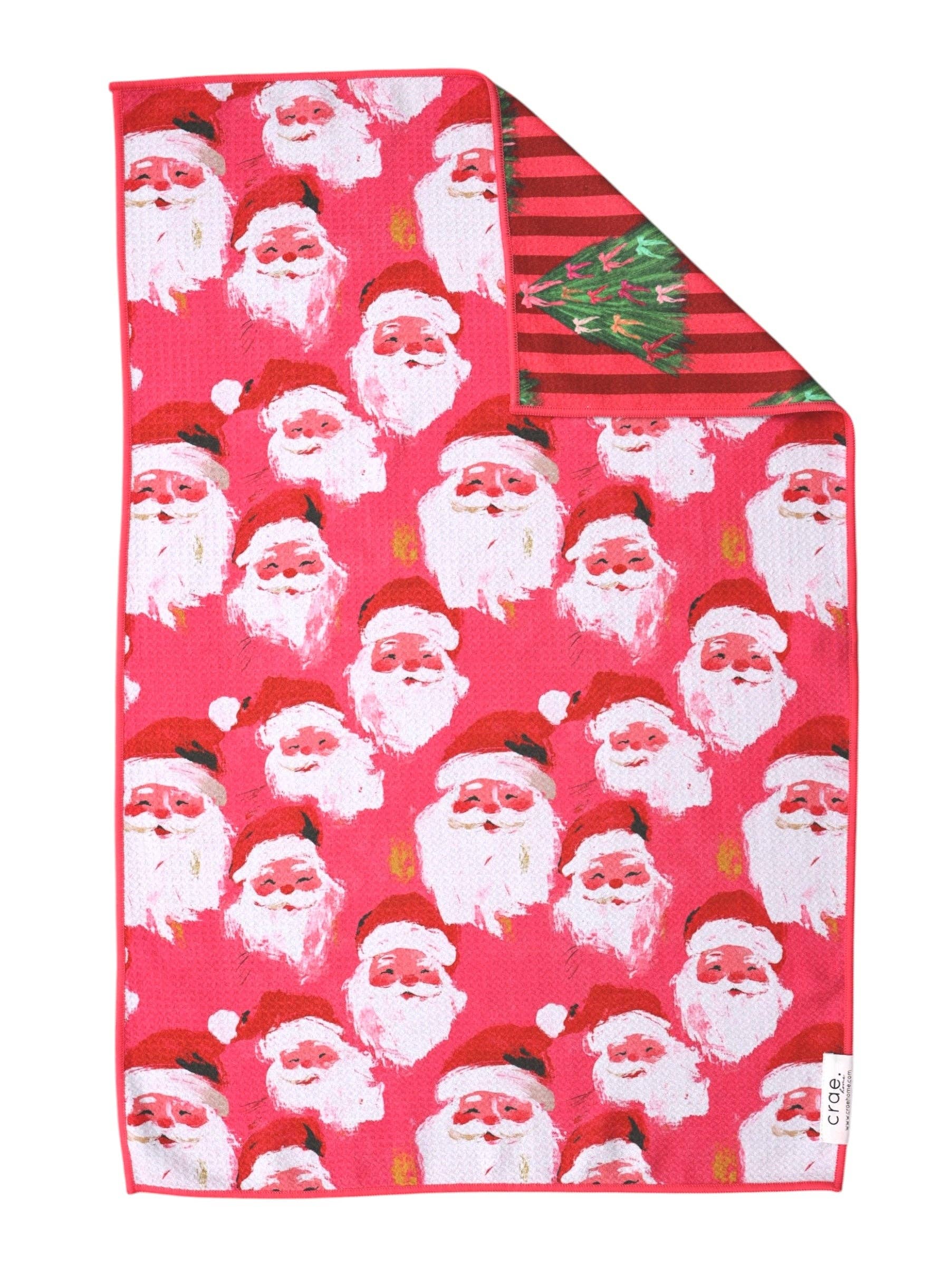Reversible Christmas hand towel with vintage Santas and pink striped Christmas trees.