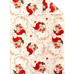 Crae Double-sided hand towel with vintage Santa faces, red hats, and scattered stars for Christmas décor.