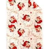 Crae Double-sided hand towel with vintage Santa faces, red hats, and scattered stars for Christmas décor.