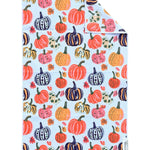Double-sided fall hand towel with colorful orange, pink, navy, cream and yellow pumpkins.