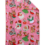 Pink Christmas hand towel with retro Santa, reindeer, snowmen, children, and festive holiday illustrations.
