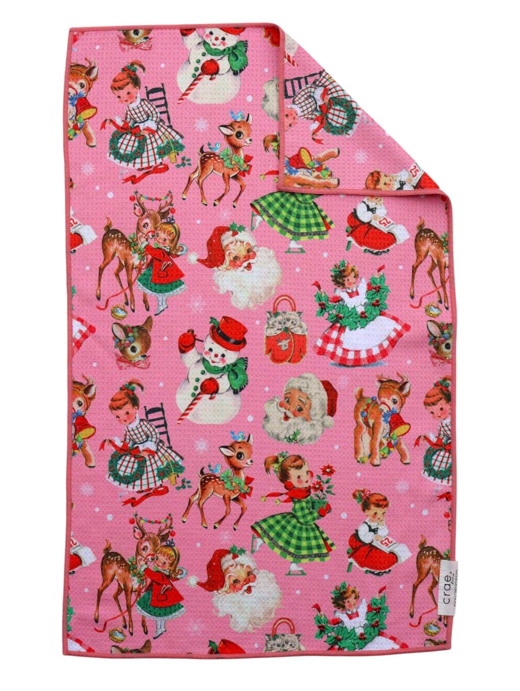 Pink Christmas hand towel with retro Santa, reindeer, snowmen, children, and festive holiday illustrations.