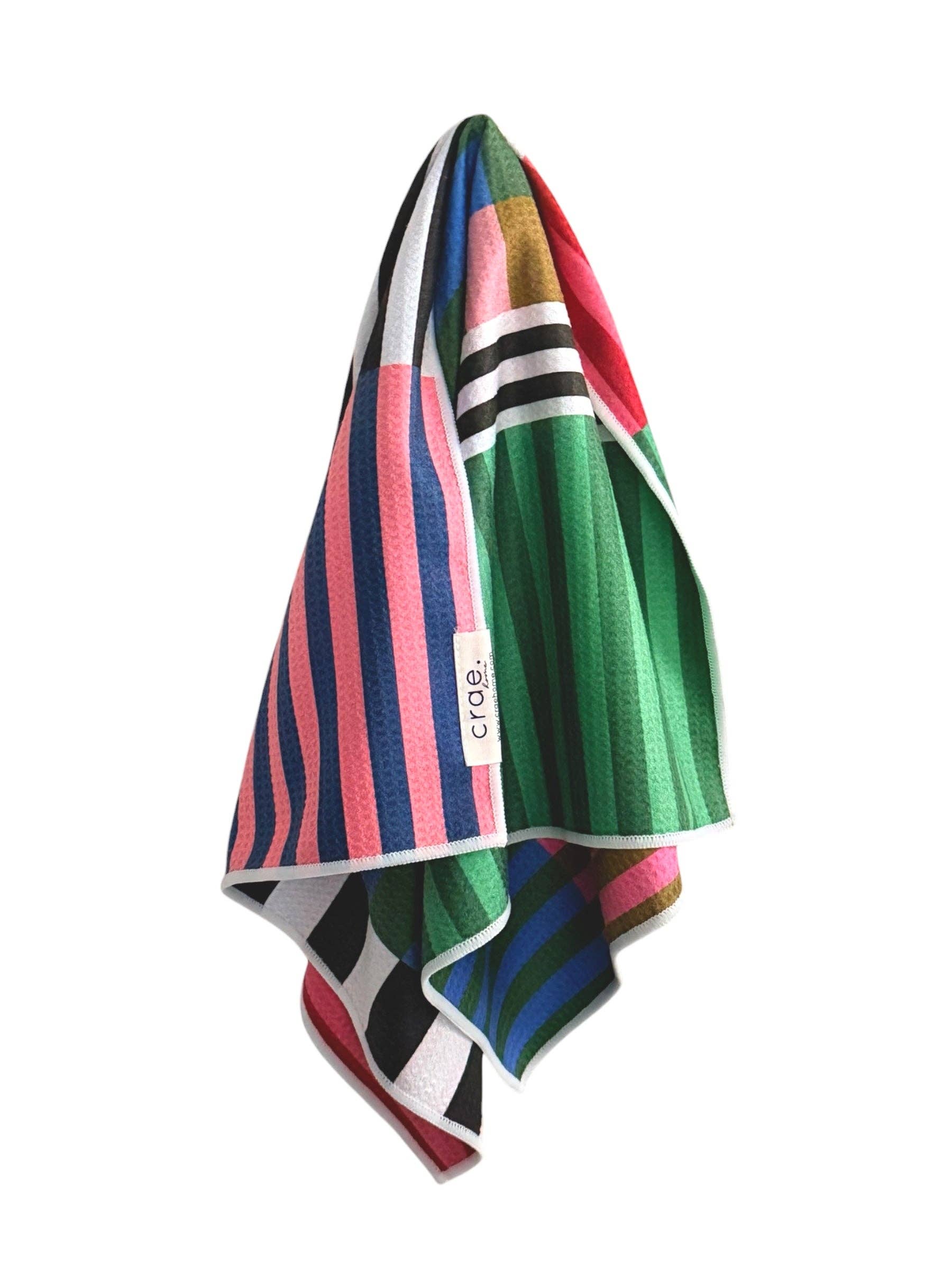 Crae Palette Play reversible towel with colorful stripes and bold geometric color-block patterns.