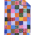 Crae Patchwork Quilt hand towel with colorful gingham, florals, dots, and abstract patchwork patterns.