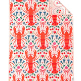 Reversible Crae towel with red lobsters, colorful florals, cherries, bows, and vintage-style frames.