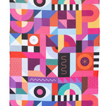 Crae Prism microfiber hand towel, 17x27 in, bold geometric patchwork in pink, purple, teal, and yellow.