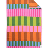 Crae Saltwater Taffy hand towel with bold pink, orange, green, blue, brown, and lime stripes.