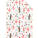 White Christmas towel with watercolor ballerinas, nutcrackers, toy soldiers, candy canes, and presents.
