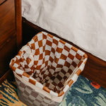 Brown and white checkered 4-gallon trash liners for small waste baskets.