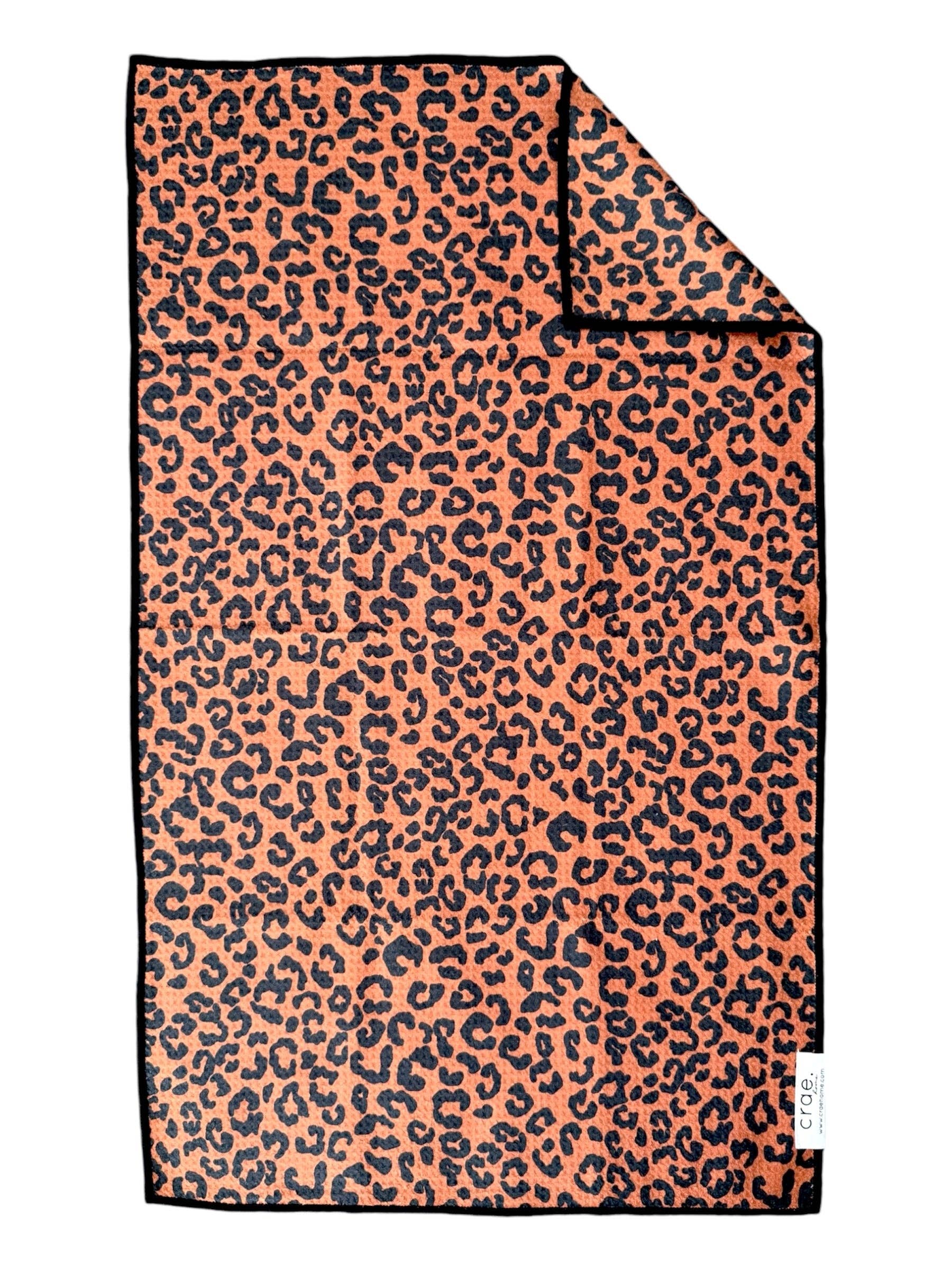 Crae Wild Cat double-sided hand towel with bold allover leopard print.