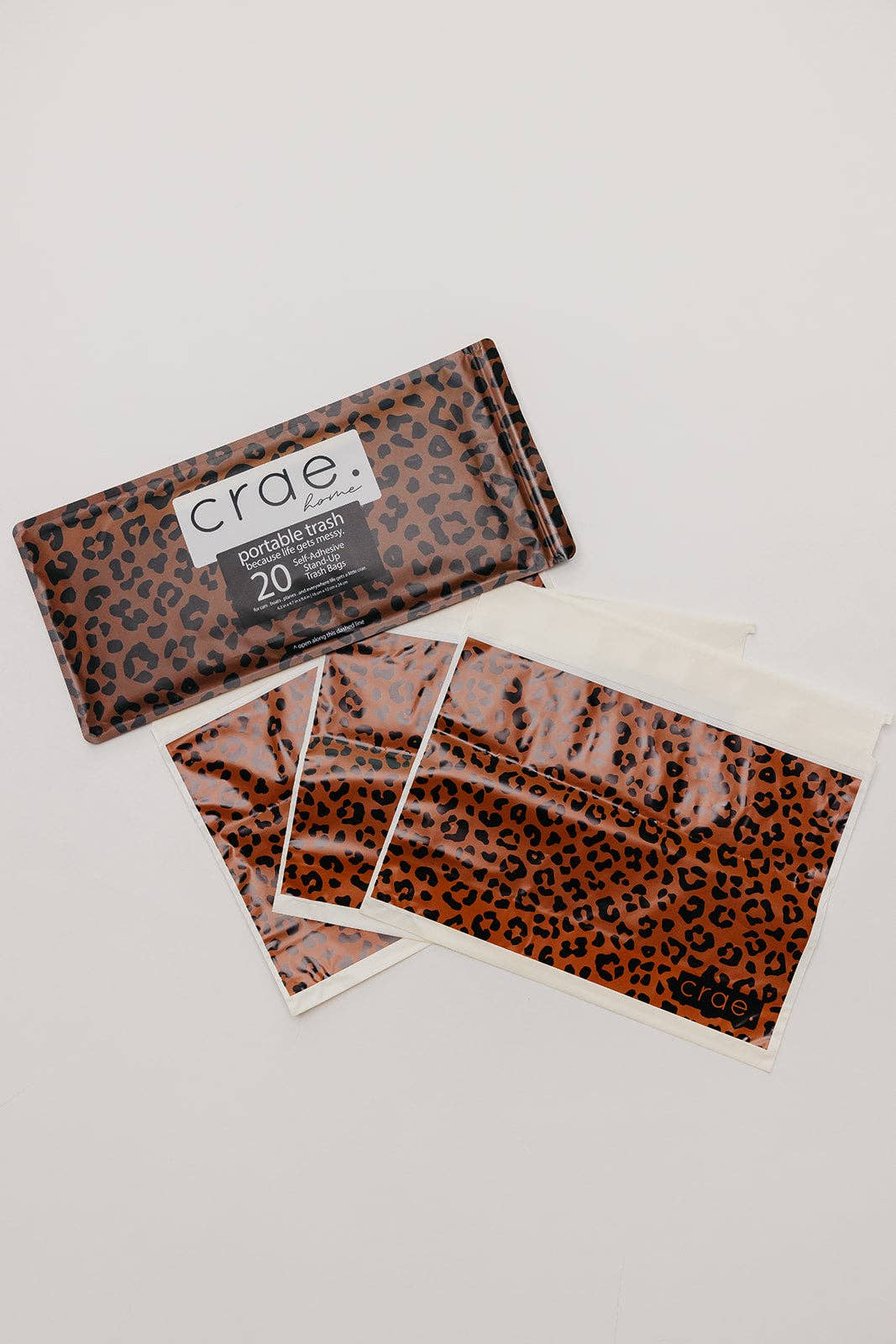 Crae Wild Cat peel-and-stick portable trash bags featuring a bold leopard print.
