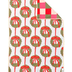 Crae reversible hand towel with green Christmas wreaths, red bows, and colorful checkered backing.