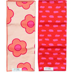 Two Crae hand towels with peach pink florals and red pink dash print.